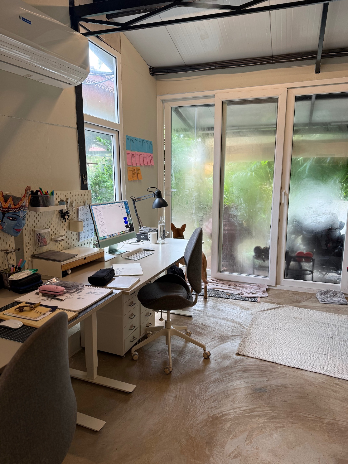 Studio workspace with desks and garden view