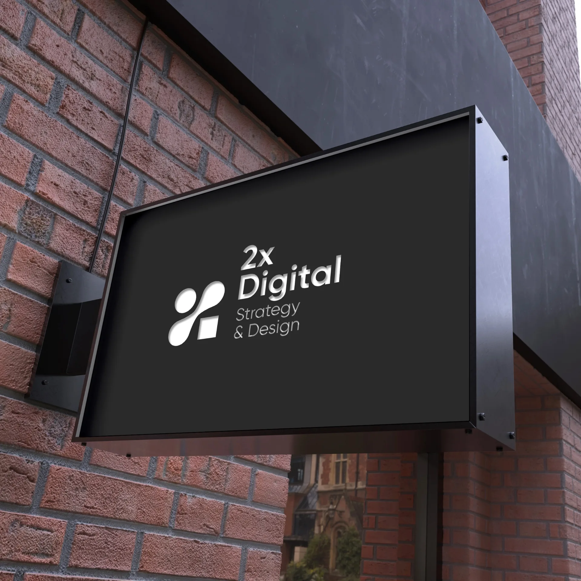 2X Digital exterior signage on black background showcasing Strategy & Design positioning