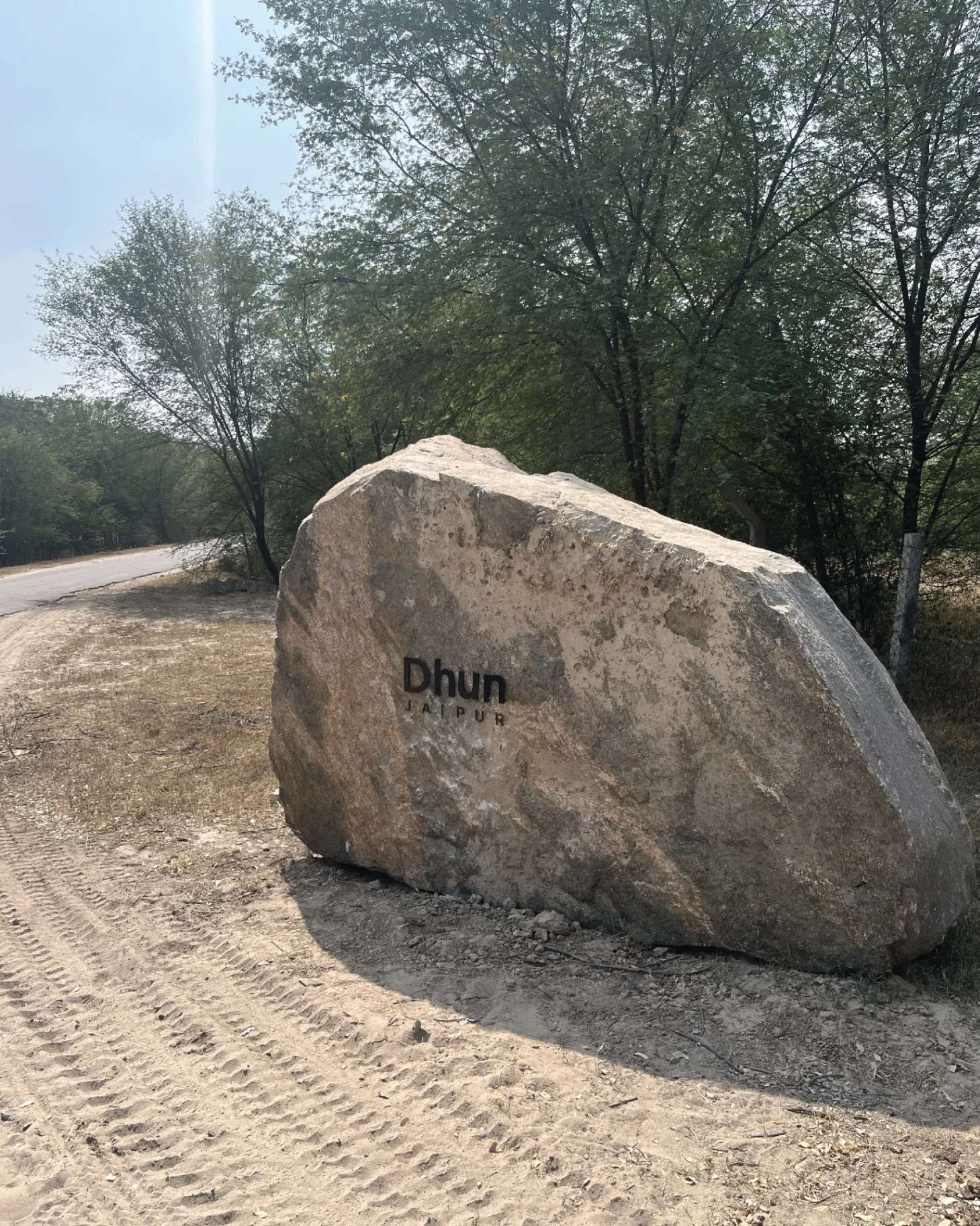DHUN - Entrance stone signage with Dhun Jaipur branding