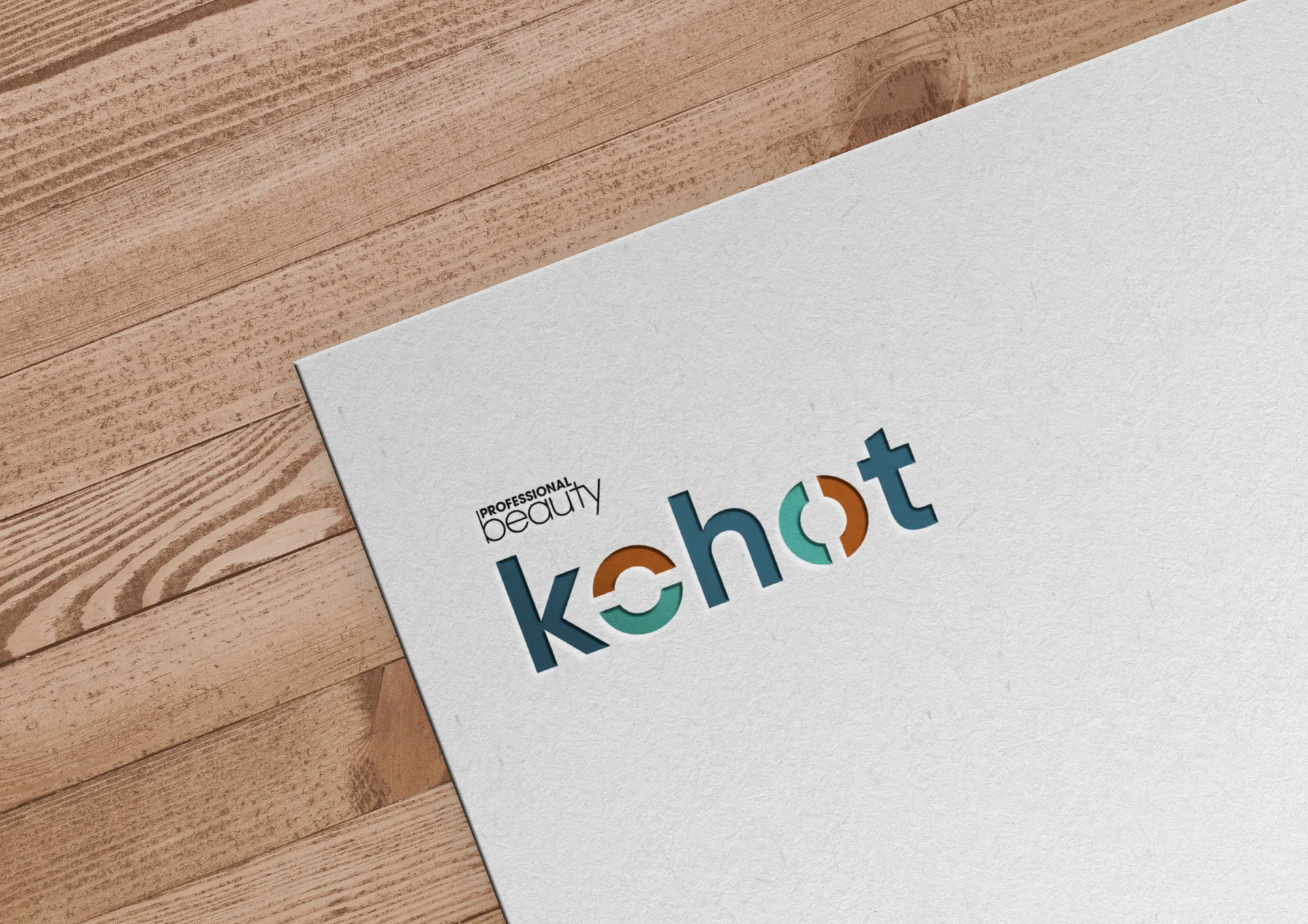 KOHOT - Logo design on paper mockup showcasing Professional Beauty branding with interlocking circles