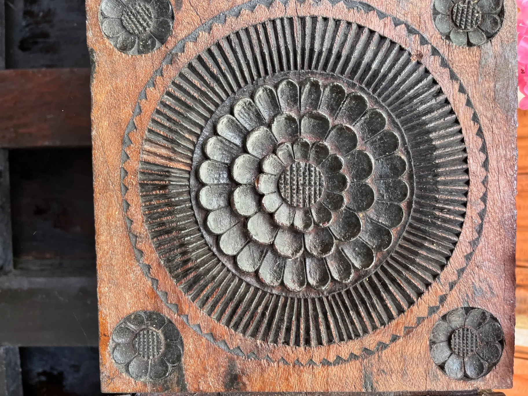 Traditional Kodava wooden carving with lotus pattern