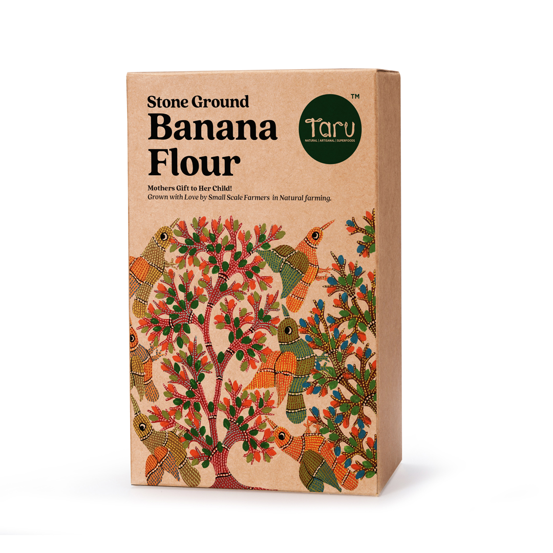 Taru Naturals - Stone Ground Banana Flour packaging featuring vibrant Gond art of peacocks and flowering trees