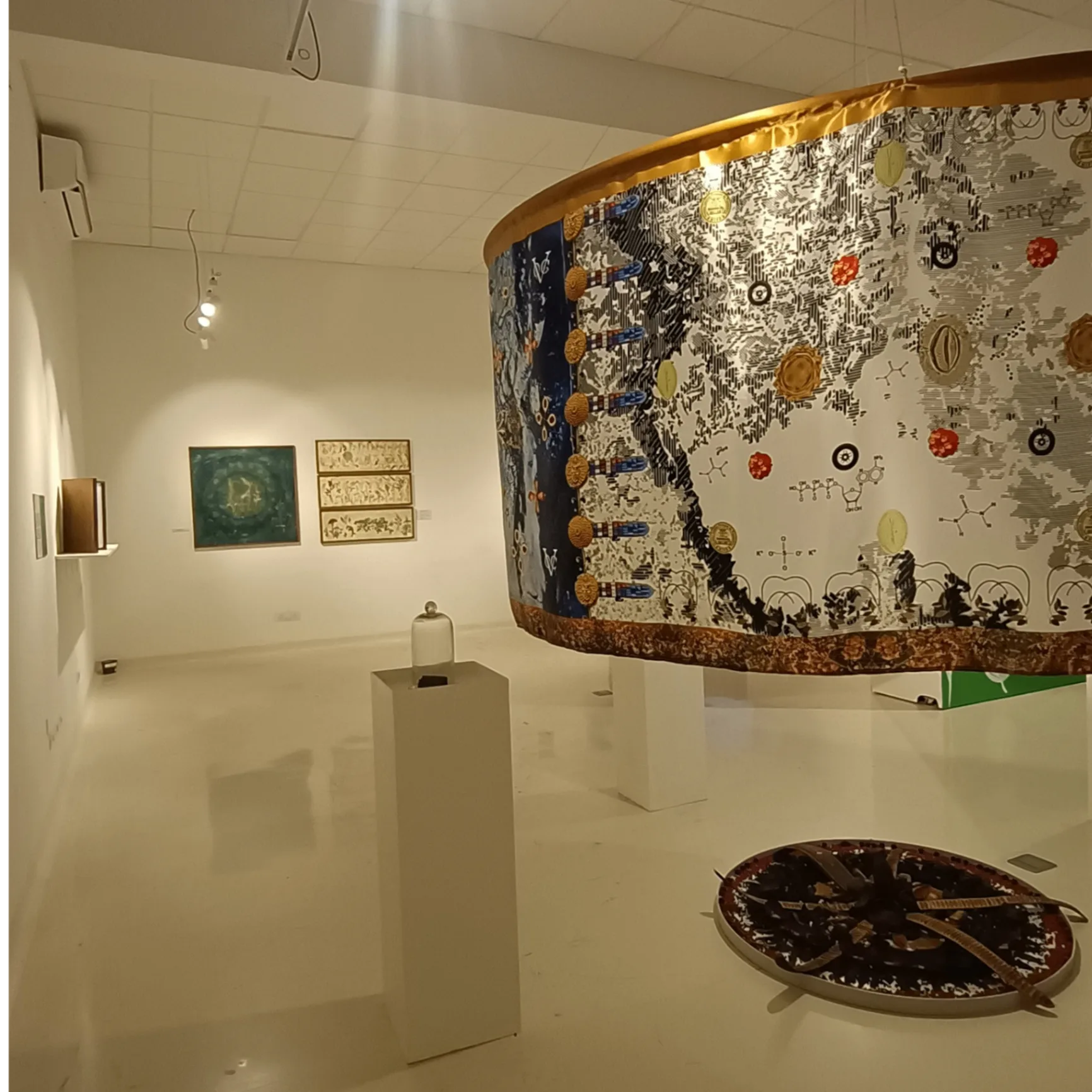 Curved gallery wall displaying interactive Travelling Plants exhibition with botanical mapping and visitor engagement areas