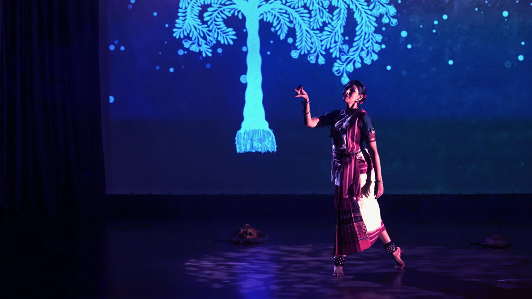 When Walls Dance - Blue stage performance with tree projection